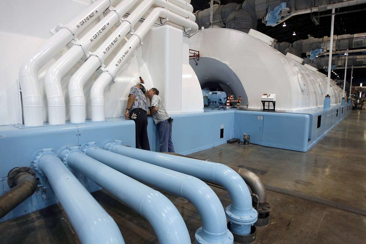 PG&E employees inspect a newly renovated turbine generator at the Diablo Canyon nuclear power plant in Avila Beach, Calif. on Friday, May 26, 2006. PAUL CHINN/The Chronicle