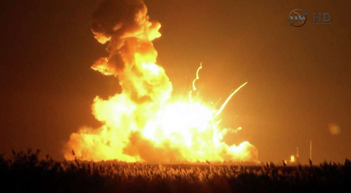 This image taken from video provided by NASA TV shows Orbital Sciences Corp.'s unmanned rocket blowing up over the launch complex at Wallops Island, Va., just six seconds after liftoff. The company says no one was believed to be hurt and the damage appeared to be limited to the facilities. (AP Photo/NASA TV) ORG XMIT: NYKS101
