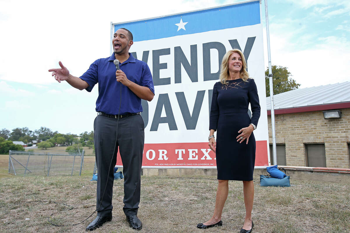 Wendy Davis stops to campaign stump with Tommy Calvert at the Claude Black Center on the East Side on October 28, 2014.