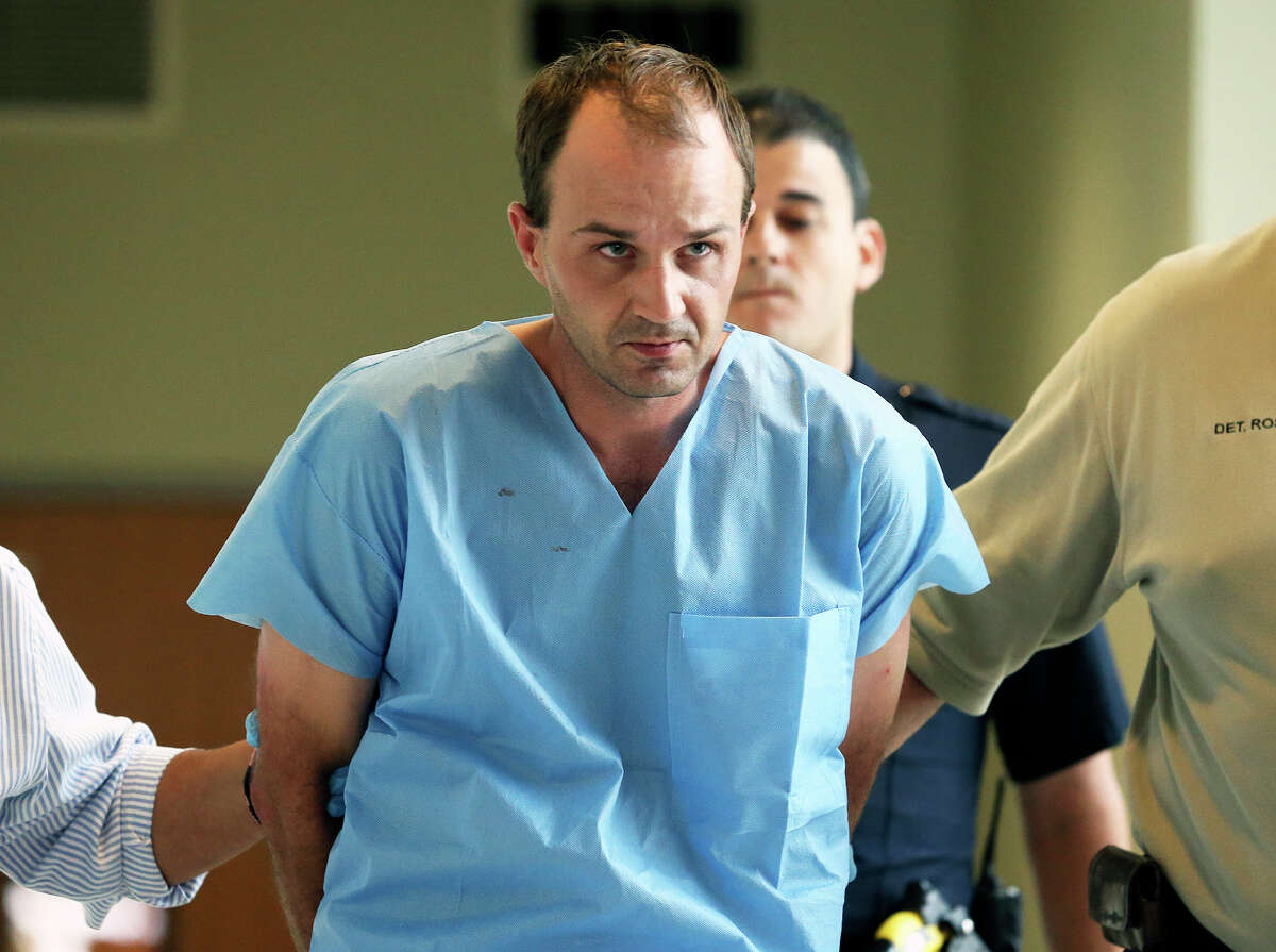 Bo Jett Littleton is taken away from SAPD downtown on October 29, 2014.