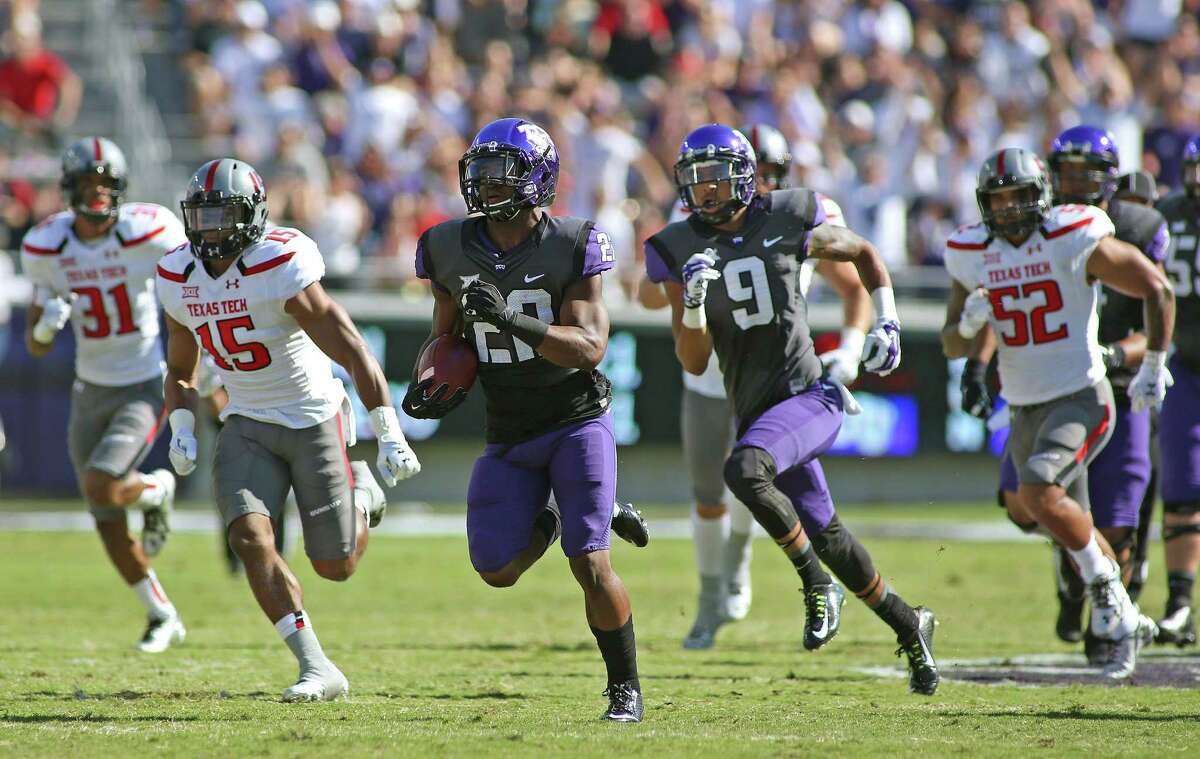 TCU running back Aaron Green (22) takes off on a 62-yard touchdown run in the first quarter against Texas Tech on Oct. 25.