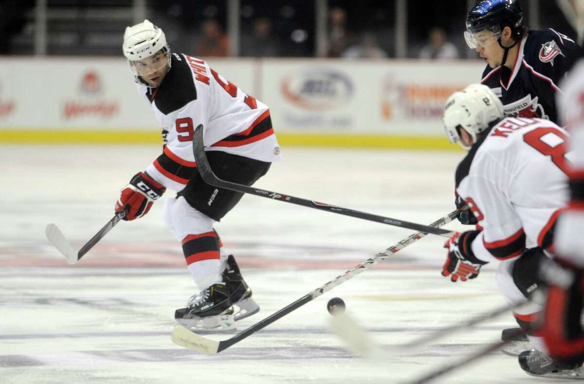 Albany's Joe Whitney, left, and Dan Kelly move the puck up the ice during their hockey game against Springfield at the Times Union Center on Wednesday Oct. 29, 2014 in Albany, N.Y. (Michael P. Farrell/Times Union)