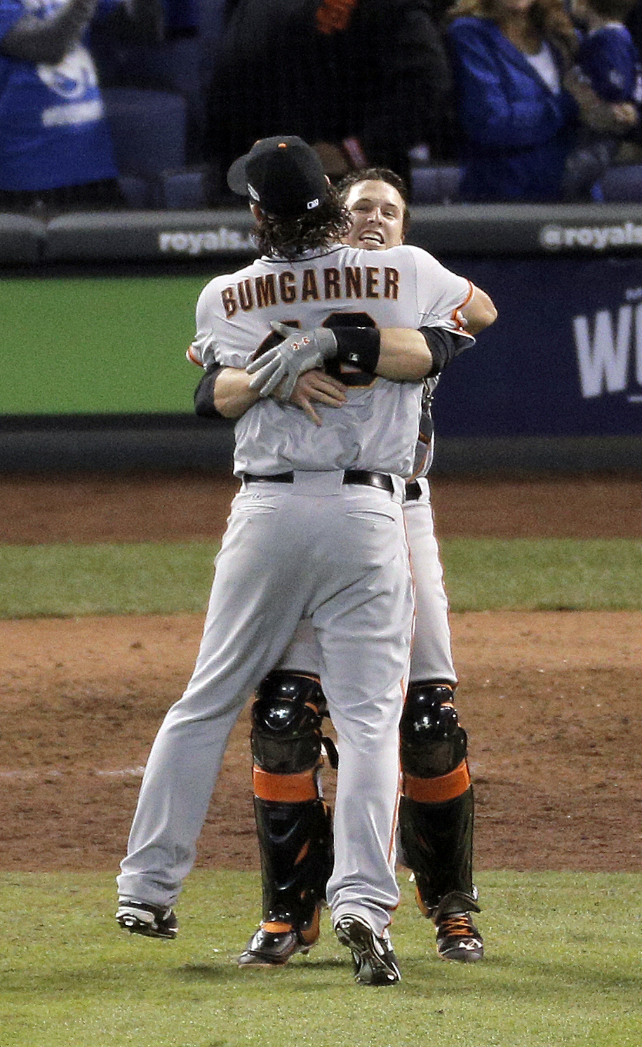 San Francisco Giants pitcher and World Series MVP Madison Bumgarner (R)  hugs his catcher Buster Posey after the final out in game 7 of the World  Series at Kauffman Stadium in Kansas