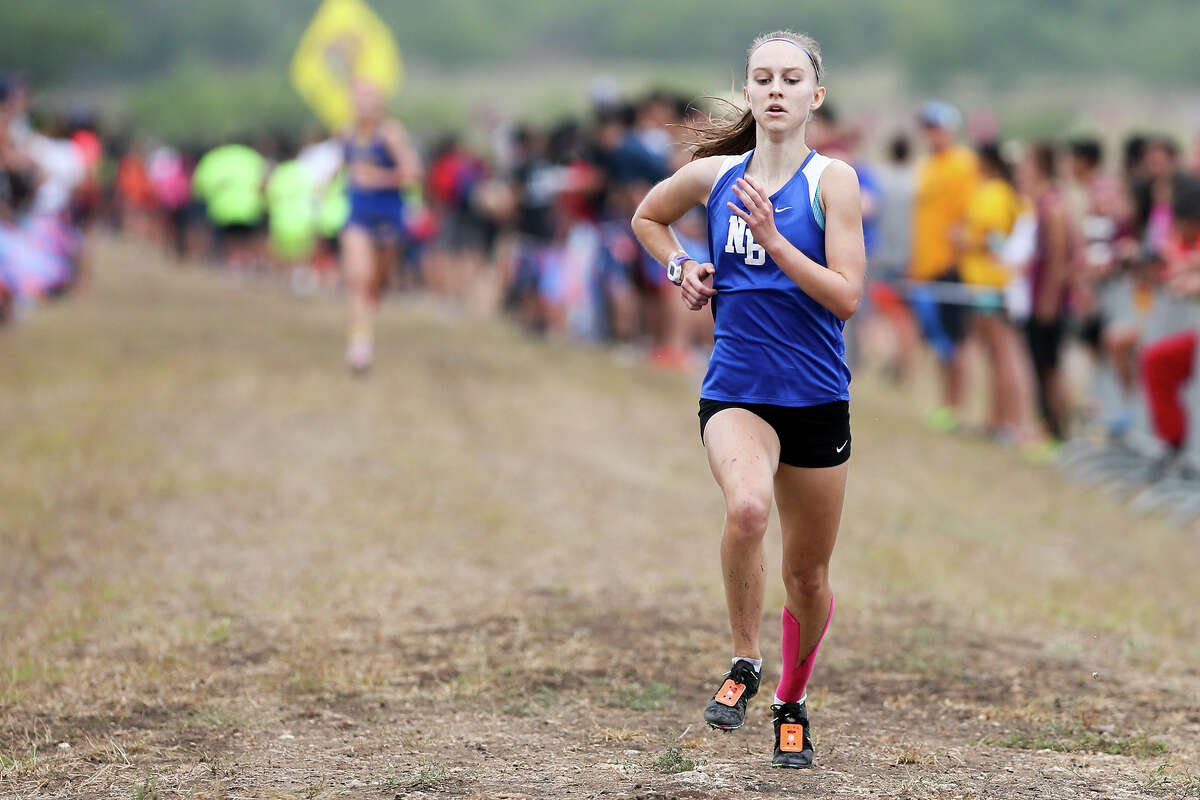 Paige Hofstad of New Braunfels approaches the finish line of the Gold Girls 5K during the UTSA Ricardo Romo Classic cross country meet at the National Shooting Complex on Saturday, Sept. 20, 2014 . Hofstad finished second in the event with a time of 17 minutes, 36.8 seconds.