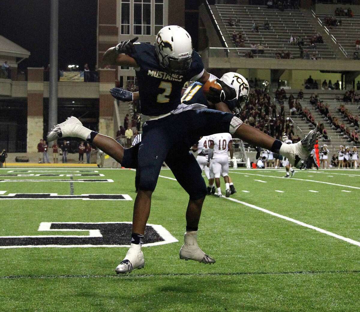 Cy Ranch's RJ Sneed II (2) celebrates one of his touchdowns during the second half of action between Cy-Fair and Cy Ranch high schools during a football game at the Berry Center, Thursday, Oct. 30, 2014, in Houston. Cy Ranch won the game 38-21.