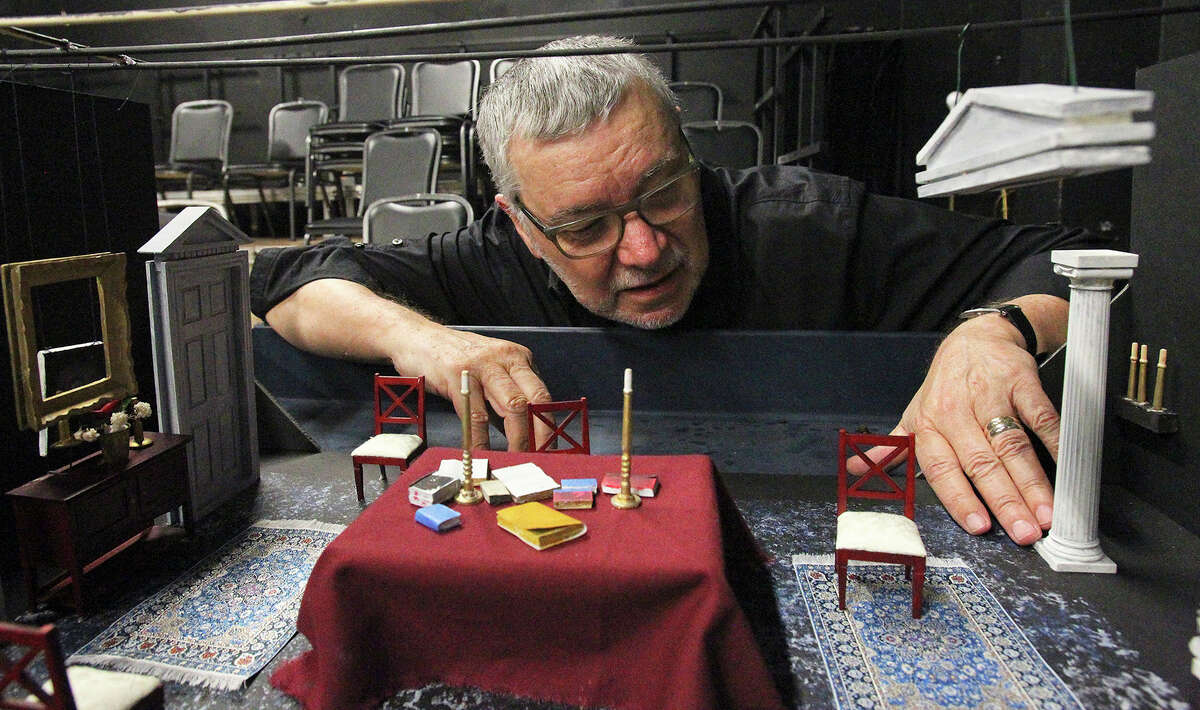 Ric Slocum shows the set model of “Ghosts.”