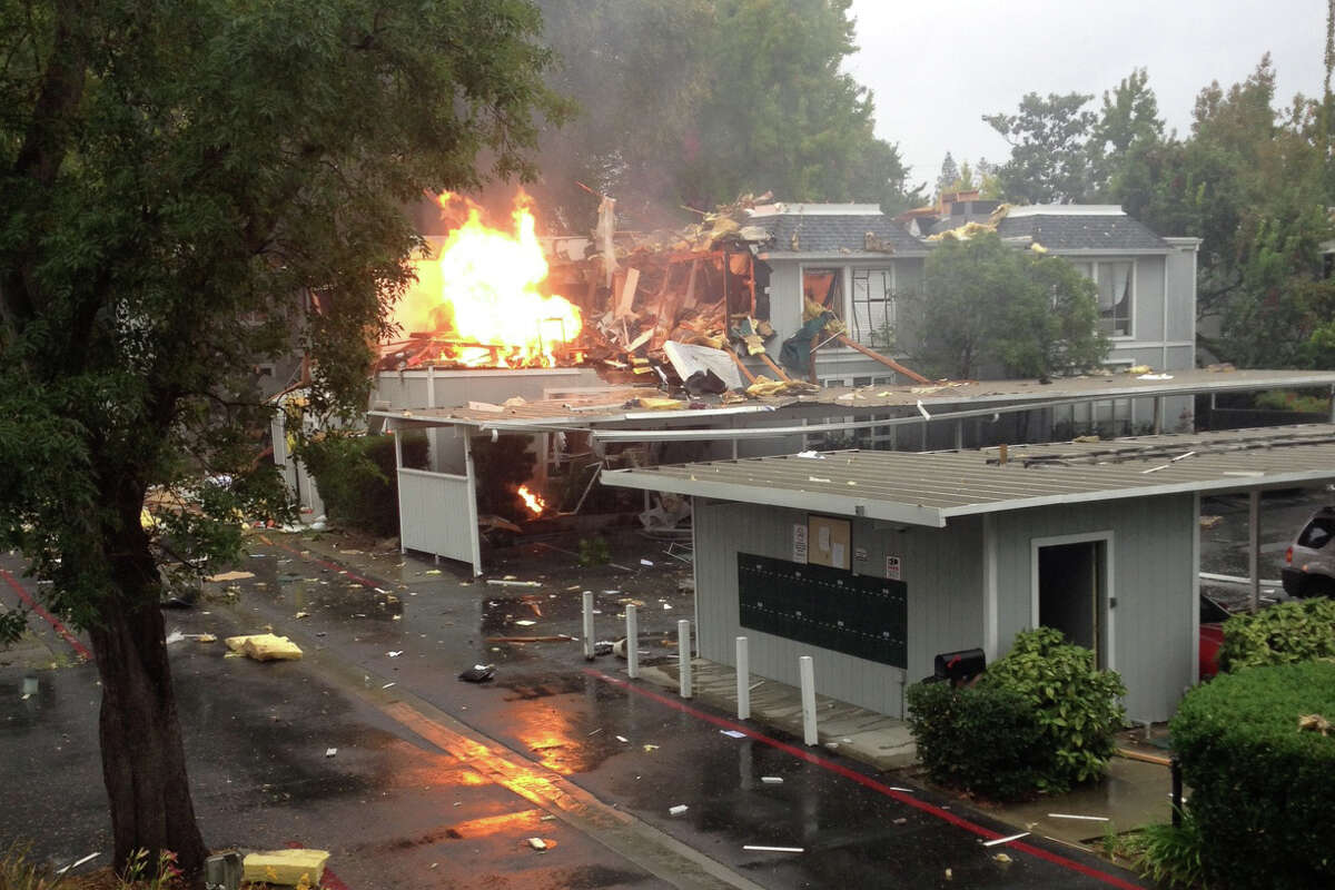 One person was missing and at least two people were hurt in an explosion and fire that tore apart a Walnut Creek apartment complex on Friday, Oct. 31, 2014. The incident was reported at the complex on the 1500 block of Sunnyvale Avenue west of Interstate 680 about 10 a.m., according to the Contra Costa County Fire Protection District.