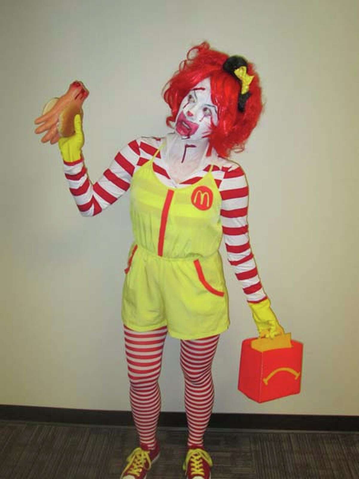 I'm Ronald McDonald holding a handburger and un-happy meal. 