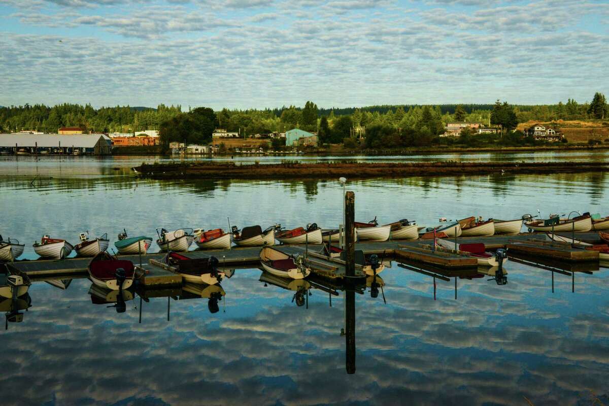 Rowboats that take anglers out for early morning fishing on the Campbell River line the Tyee Club's dock.