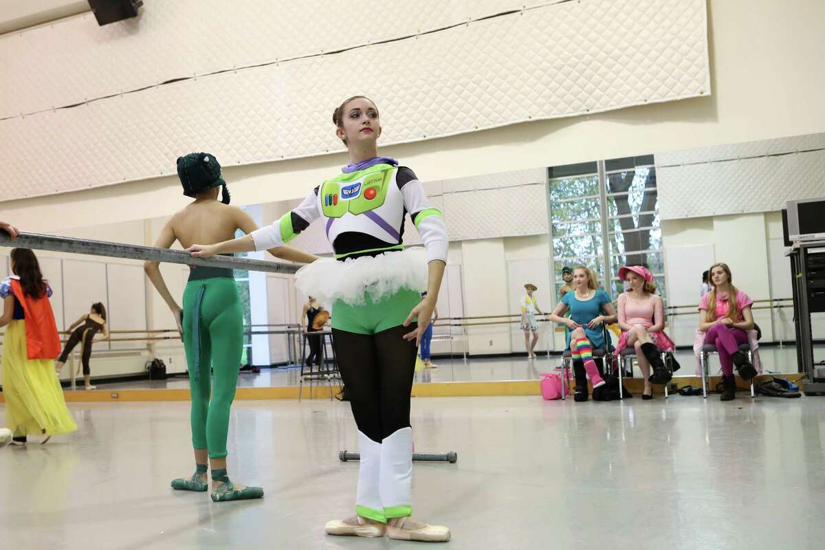 Madison Abeo, 18, dresses up as Buzz Lightyear from "Toy Story" during dance practice. Students of the Pacific Northwest Ballet School's Professional Division abandoned their strict dress codes to dress up in the spirit of Halloween for their morning class on Friday, Oct. 31, 2014 in Seattle, WA.