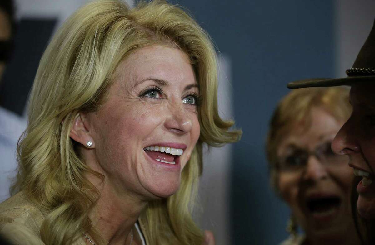 Senator Wendy Davis speaks with supporters as she makes a stop in San Antonio at her Northeast Side field office, which is probably her last stop in San Antonio before election. Friday, Oct. 31, 2014.