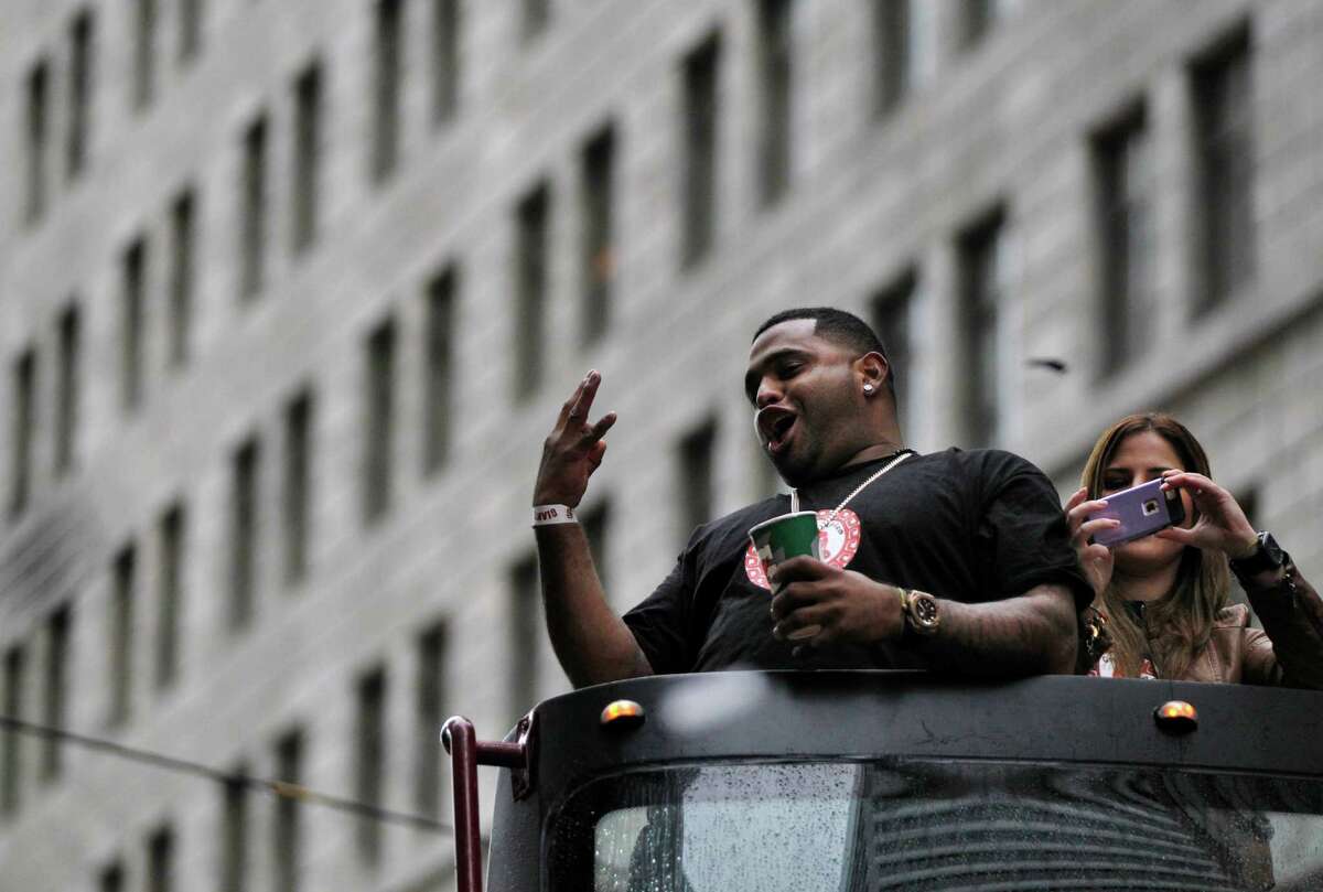Pablo Sandoval holds up the number three while cheering with hundreds of thousands of spectators during the World Series Parade celebrating the victorious San Francisco Giants Oct. 31, 2014 in downtown San Francisco, Calif. The Giants won the World Series 4-3 against the Kansas City Royals on Wednesday night. The celebration parade was held on Friday starting at Market and Steuart Streets and ended at Civic Center Plaza.