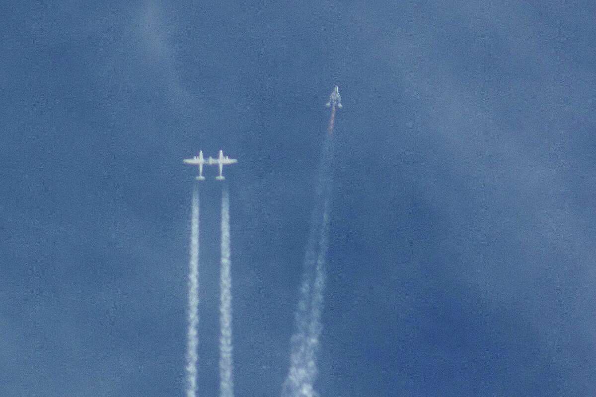 The Virgin Galactic SpaceShipTwo rocket separates from the carrier aircraft prior to it exploding in the air during a test flight on Friday, Oct. 31, 2014. The explosion killed a pilot aboard and seriously injured another while scattering wreckage in Southern California's Mojave Desert, witnesses and officials said.