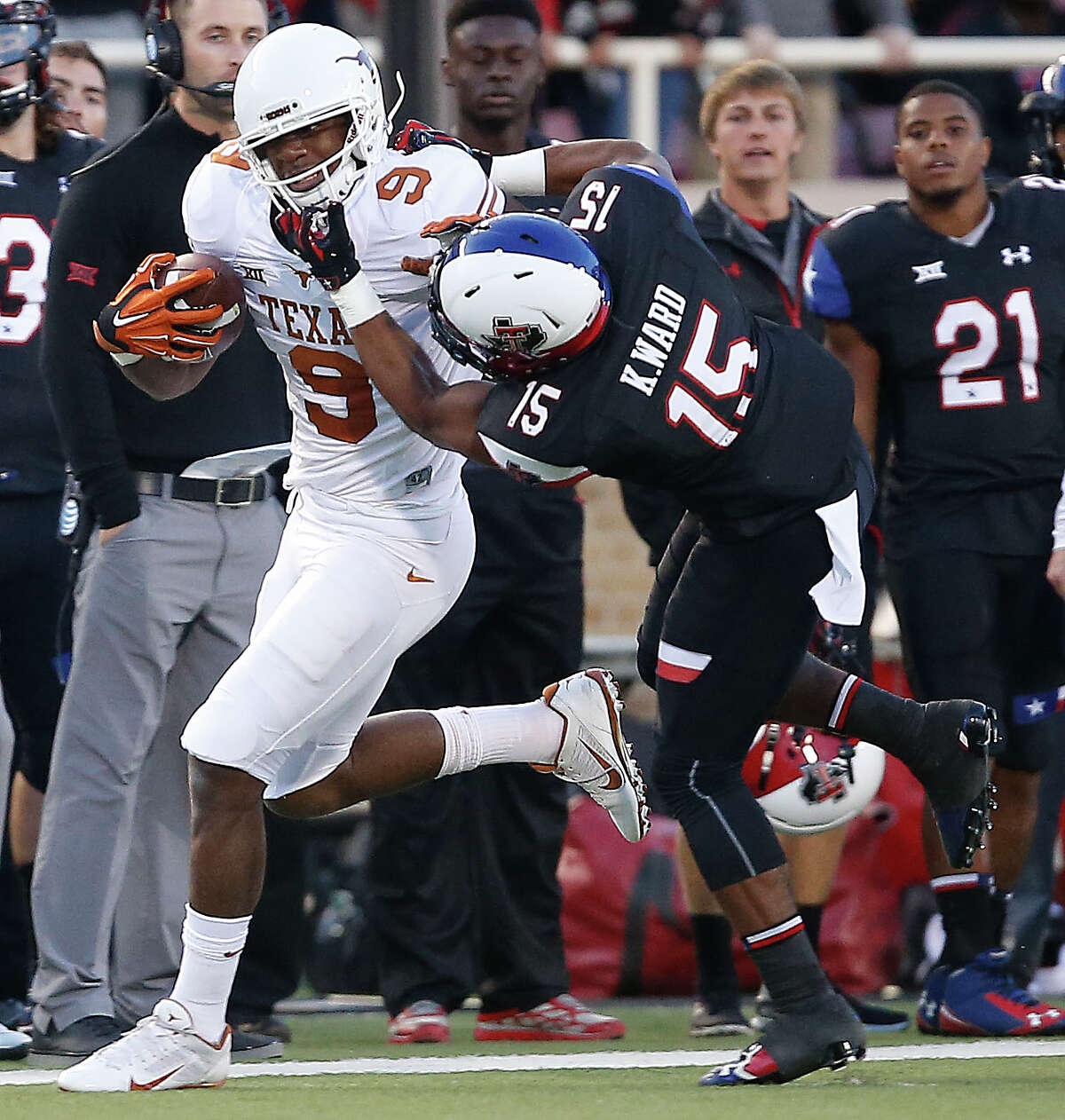 Texas' John Harris tries to get past Texas Tech's Keenon Ward during an NCAA college football game in Lubbock, Texas, Saturday, Nov. 1, 2014. (AP Photo/Lubbock Avalanche-Journal, Tori Eichberger)