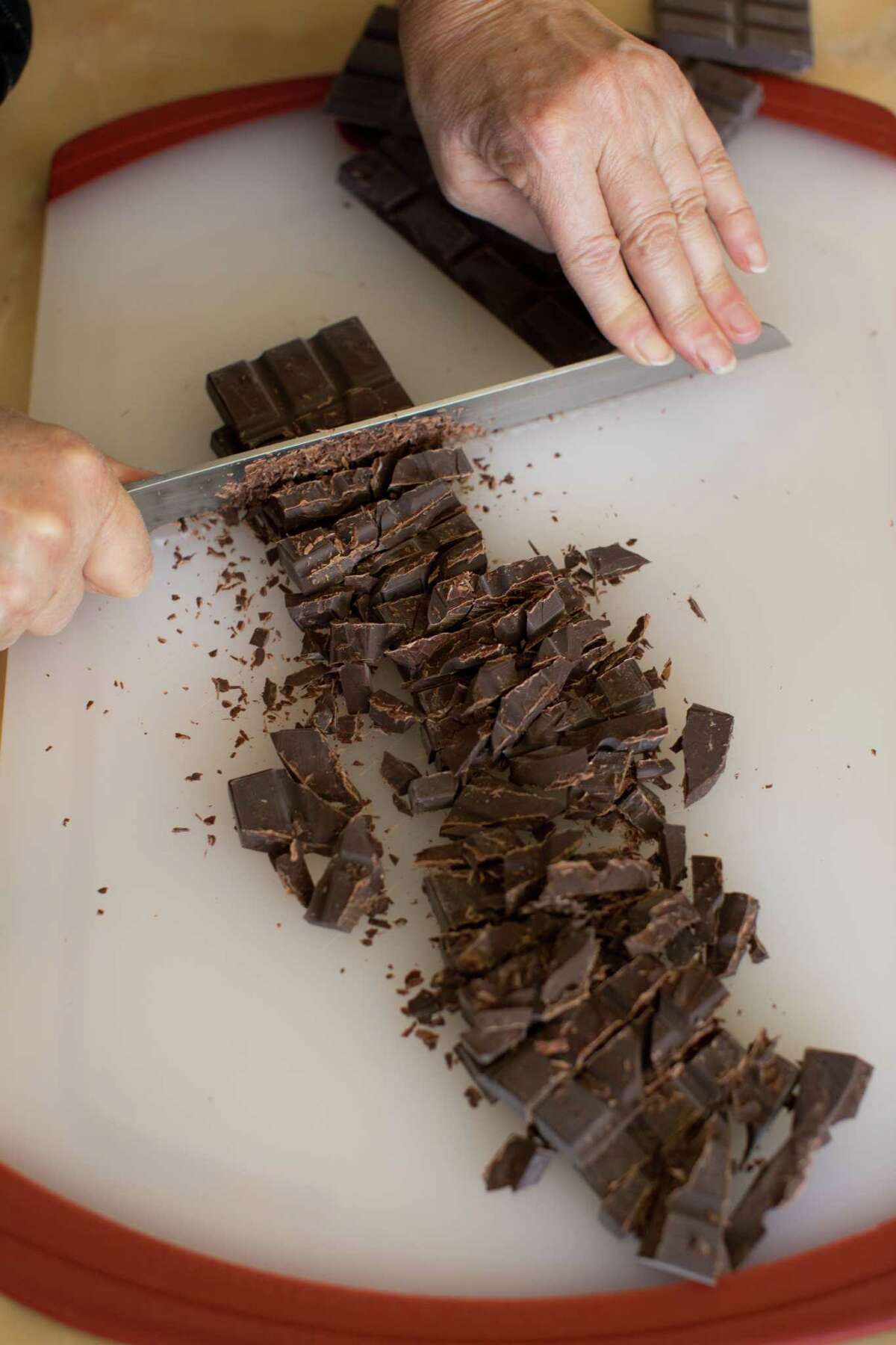 Alice Medrich chops up Guittard chocolate for her truffle recipe at her home in Berkeley.