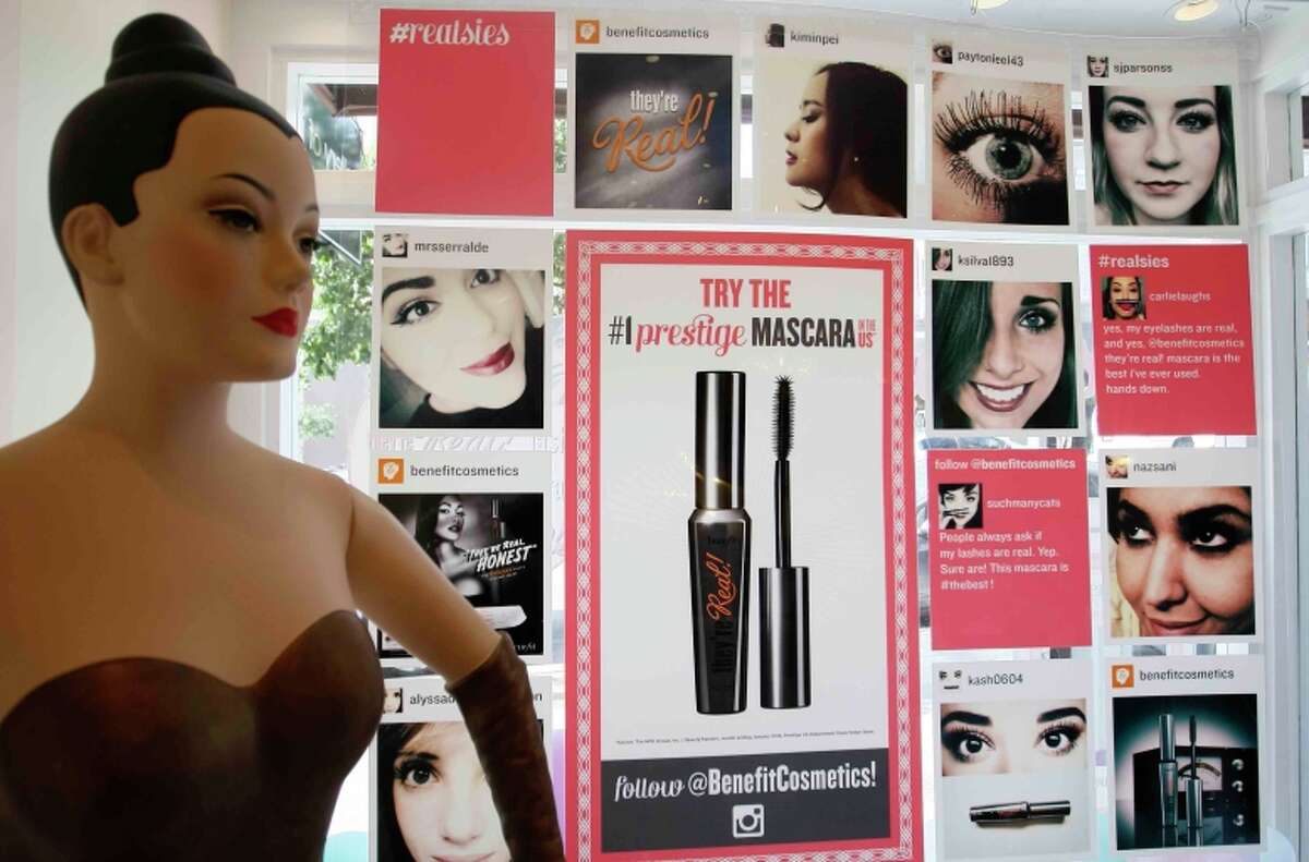 Social media is a major presence at the Benefit Cosmetics boutique on Fillmore Street in S.F., where customers’ Instagram photos are on display.