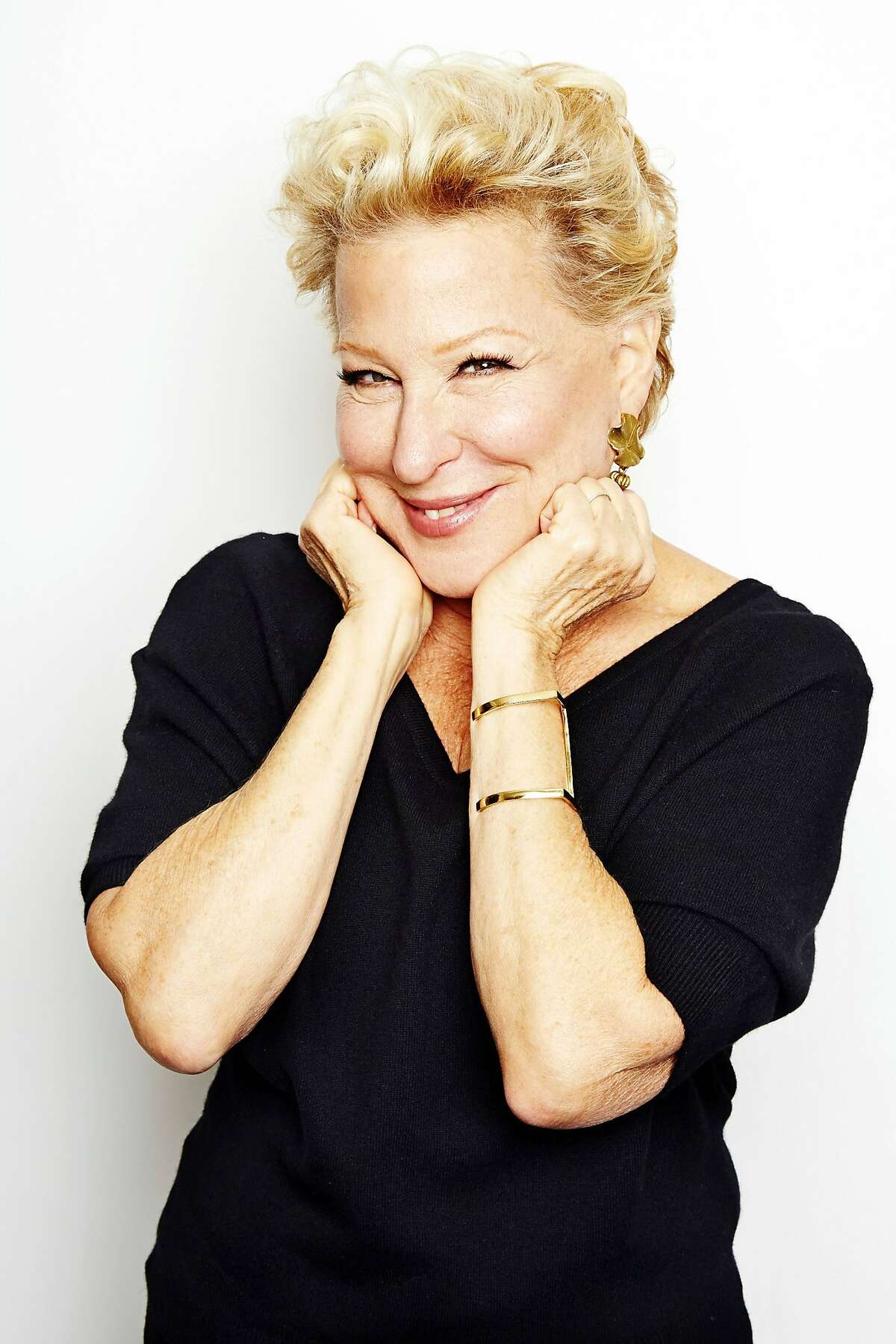 In this Oct. 7, 2014 photo, entertainer Bette Midler poses for a portrait in promotion of her upcoming album "It's the Girls!" in New York. The album is an eclectic collection of covers of 15 famous songs by seven decades of girl groups, from The Andrews Sisters to TLC. It's also Midler's 25th album and first studio offering in eight years. (Photo by Dan Hallman/Invision/AP)