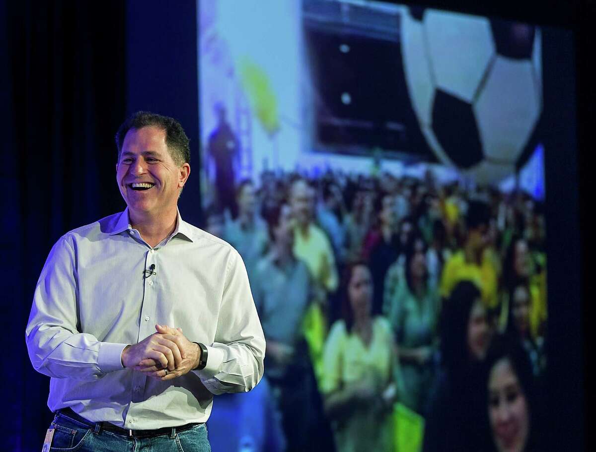 MAY 06, 2014 - Michael Dell, chairman of the board and CEO of Dell Inc. looks on as employees from Dell's Brazilian office celebrate via a live feed during Dell Inc. 30th anniversary celebration held in Round Rock, Texas, on Tuesday, May 6, 2014. (RODOLFO GONZALEZ / AMERICAN-STATESMAN)