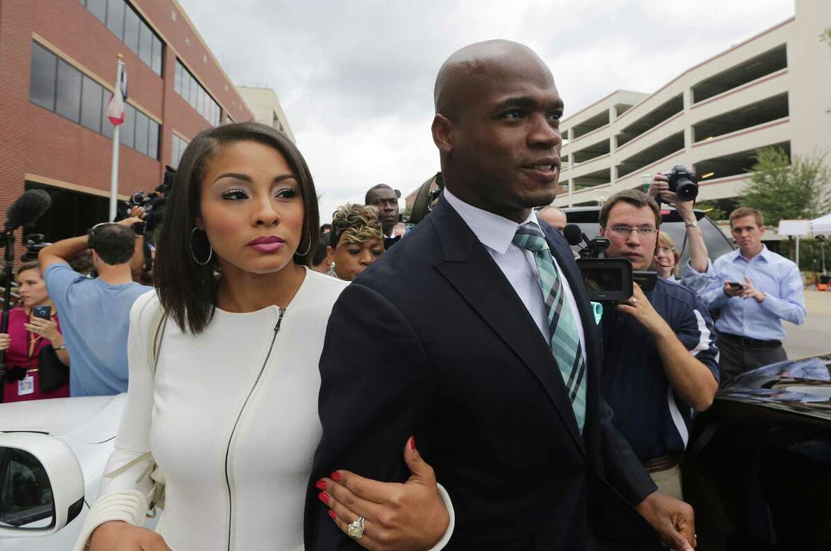 (right) Minnesota Vikings star running back Adrian Peterson and his wife Ashley Brown depart from the Montgomery County courthouse in Conroe, TX Tuesday November 4, 2014. Peterson avoided jail time in a plea agreement reached with prosecutors to resolve his child abuse charge. Peterson's plea to the Class A misdemeanor comes with two years of deferred adjudication. Peterson also received a $4,000 fine and 80 hours of required community service. (Billy Smith II / Houston Chronicle)