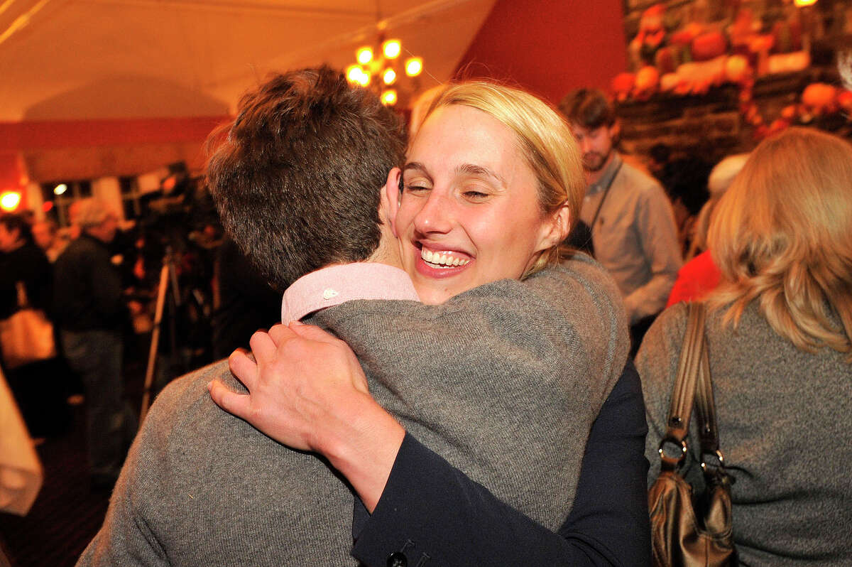 Caroline Simmons, a candidate for State Representative in the 144th District, hugs her field director Harrison Nantz during the Democrat Party election night celebration at Zody's 19th Hole at E. Gaynor Brennan Golf Course in Stamford, Conn., on Nov. 4, 2014.