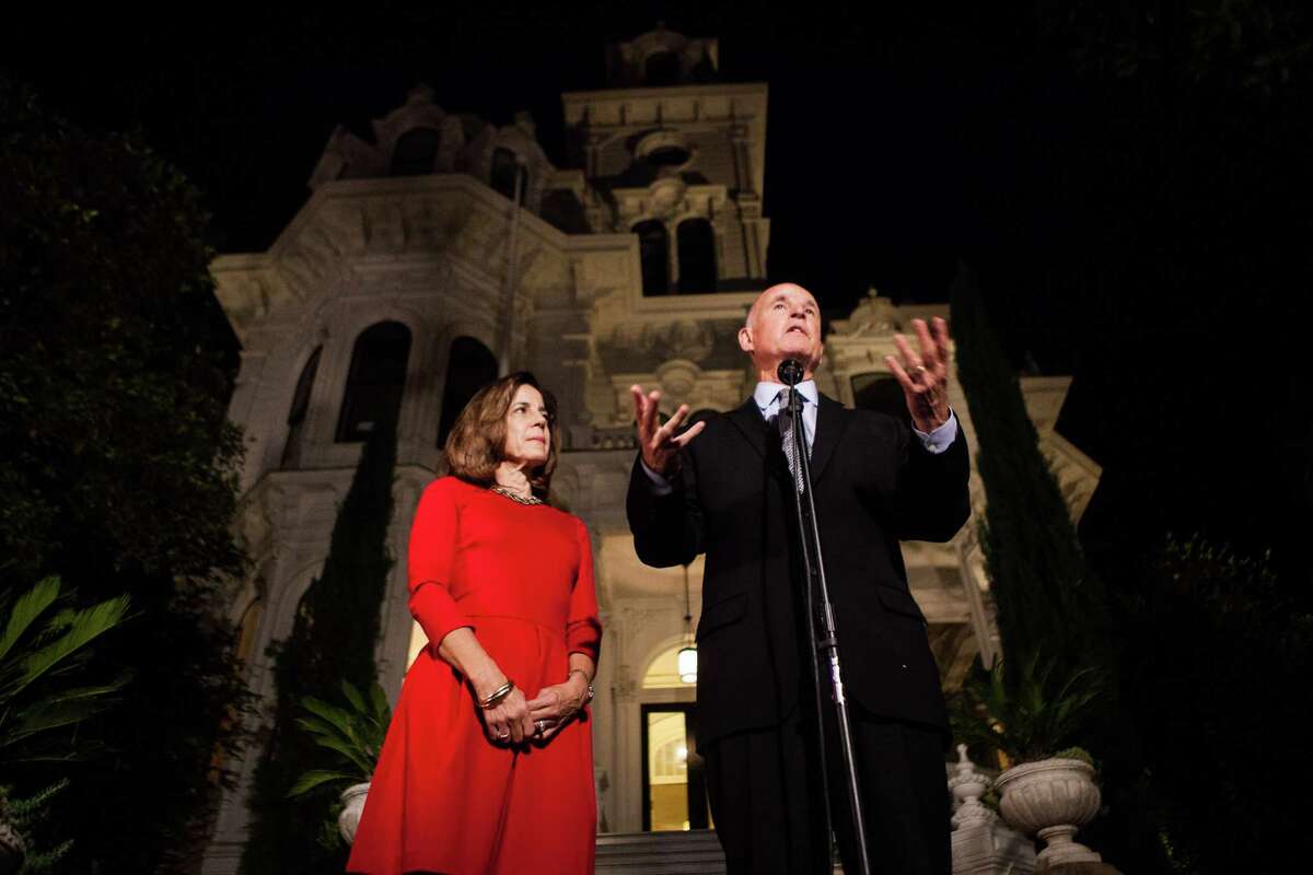 Gov. Jerry Brown, with Anne Gust Brown, speaks to the media after being reelected to a fourth term in front of the Governor's Mansion in Sacramento, California, November 4, 2014.