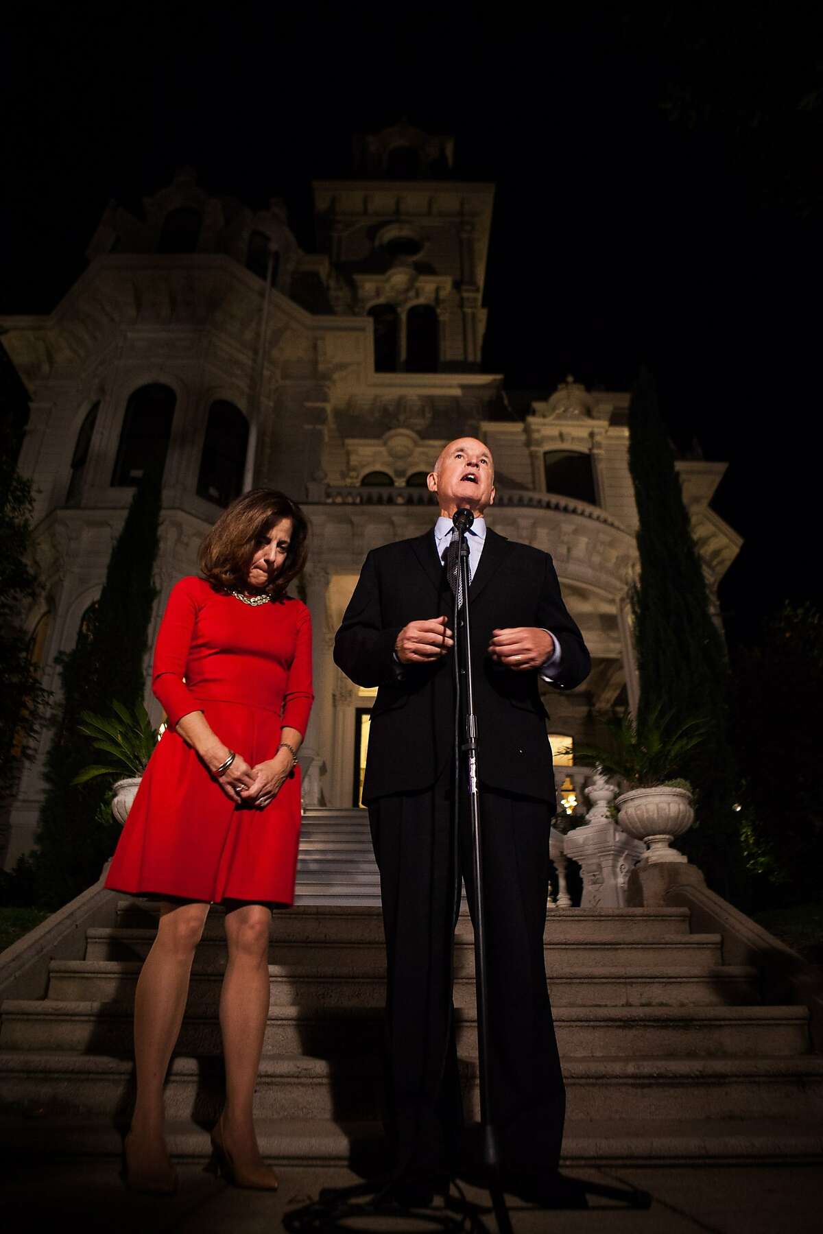 Gov. Jerry Brown, with Anne Gust Brown, speaks to the media after being reelected to a fourth term in front of the Governor's Mansion in Sacramento, California, November 4, 2014.