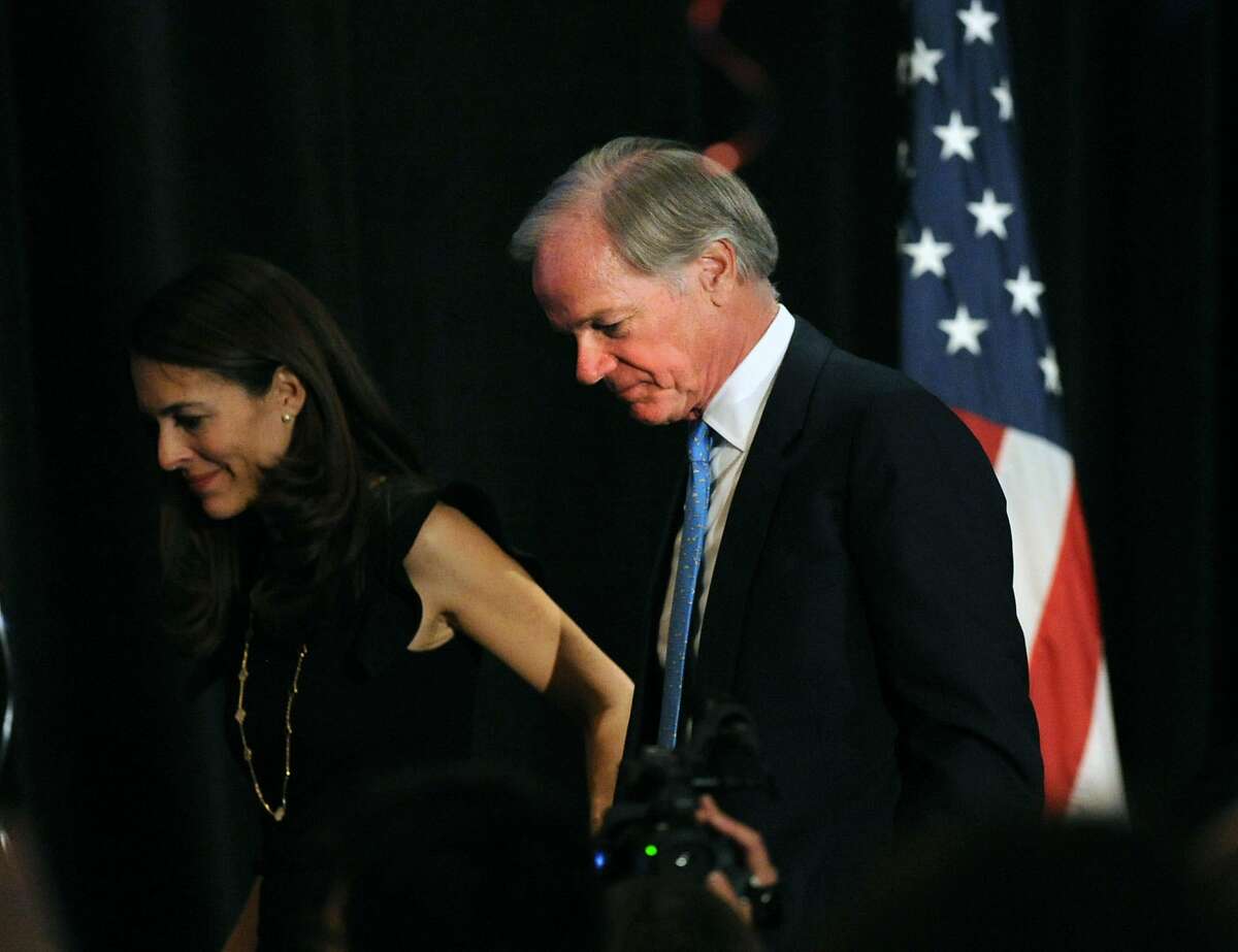 Republican candidate for Governor, Tom Foley, with his wife, Leslie, leaves the stage after Foley spoke to supporters on election night at the Hyatt Regency Greenwich, Conn., Wednesday, Nov. 5, 2014.