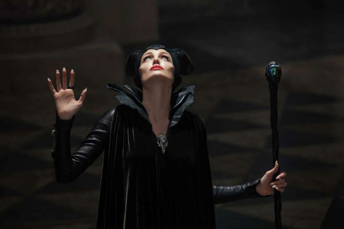 This photo released by Disney shows Angelina Jolie in a scene from "Maleficent." Spanish accesory designer Manuel Albarran created the collars and jewelry that Angelina Jolie wears on the movie âMaleficentâ, which opens in Mexico and USA on May 30. Albarran, known as a metal couturier, worked closely with Jolie to achieve a look in between wild, femenine, shining and dark using materials like fur, leather and metal. (AP Photo/Disney, Frank Connor)