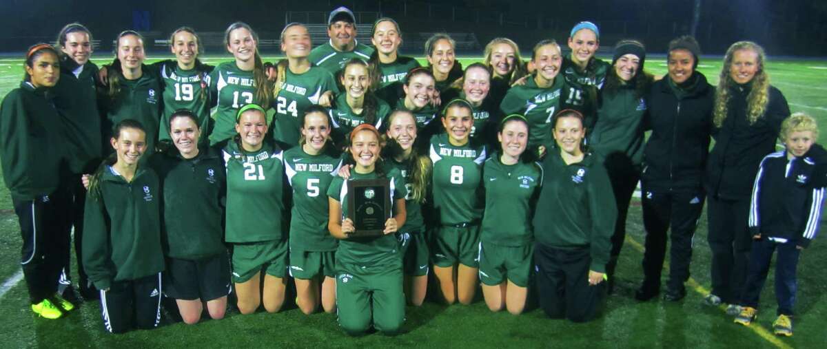 The Green Wave girls' soccer side poses for posterity moments after capturing New Milford High School's second South-West Conference championship in the sport, 2-1, over Masuk, Oct. 29, 2014 at Newtown High School.