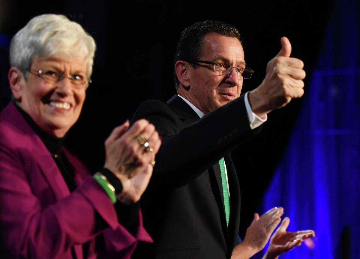 Connecticut Gov. Dannel P. Malloy gives a thumbs up beside Lt. Gov. Nancy Wyman before delcaring victory in the 2014 gubernatorial election at the Society Room in downtown Hartford, Conn. Tuesday, Nov. 4, 2014. The incumbent Democrat governor retained office, defeating Greenwich Republican Tom Foley by a narrow margin in the 2014 gubernatorial election.