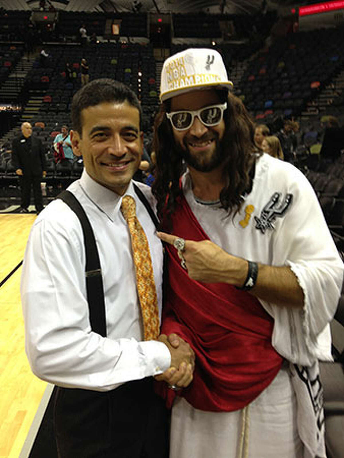 Spurs Jesus shakes hands with District Attorney-elect Nico LaHood at the AT&T Center on Wednesday, November 5, 2014.