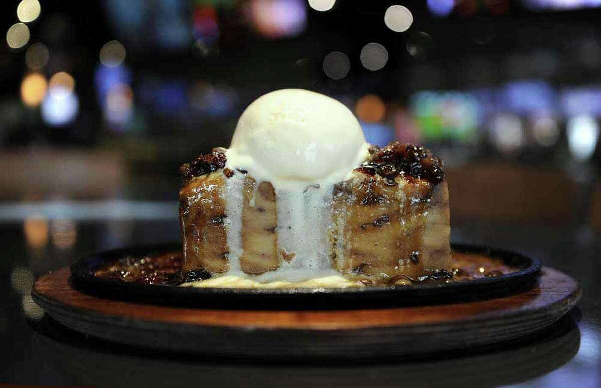 The bread pudding comes to the table sizzling at Bombshells in Spring.