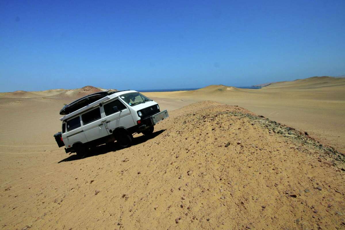 Nacho takes to the dunes in the Nazca Desert in Peru.