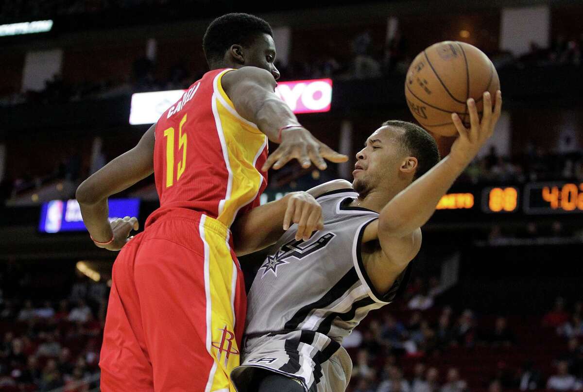 Kyle Anderson attempts to pass the ball around Rockets center Clint Capela.