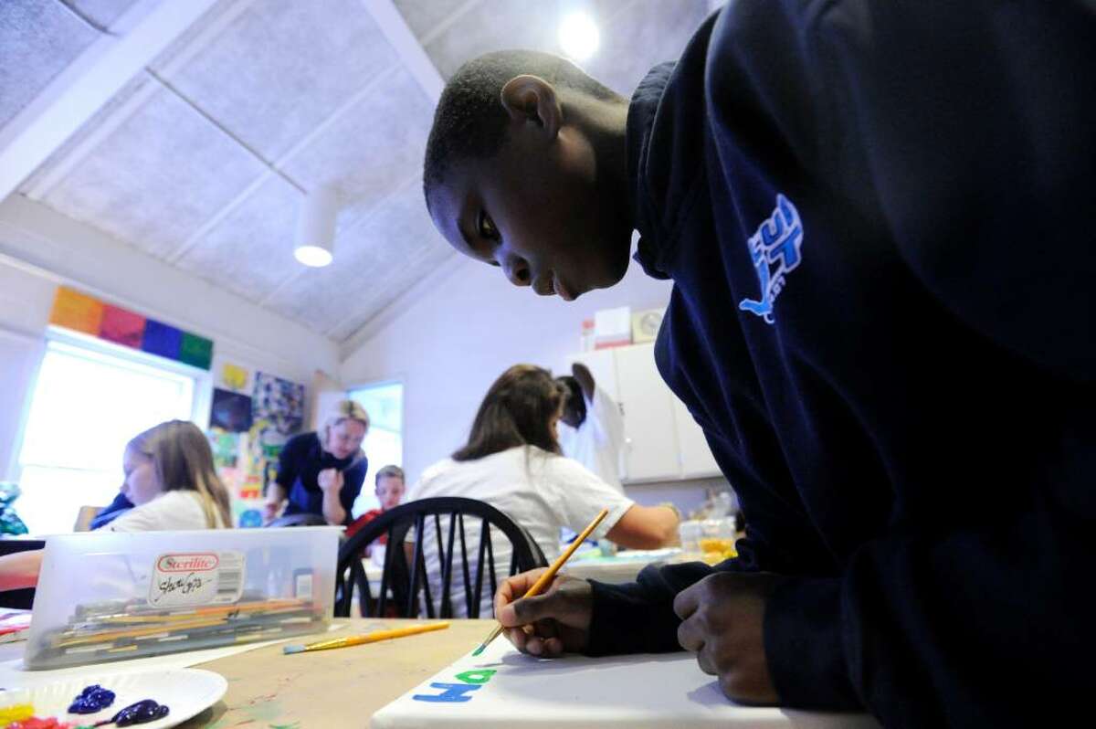 James Day, 11, works on a painting as part of the Colors of Hope: Children Helping Children at the Round Hill Studio Wednesday afternoon, Feb. 24, 2010. The program, inspired by an interest in helping Haitian children, brings local children together to create works of art inspired traditional art of Haiti. The children’s creations will be featured at the First Church of Round Hill on Sunday, February 28 as part of a fundraiser for Save the Children.