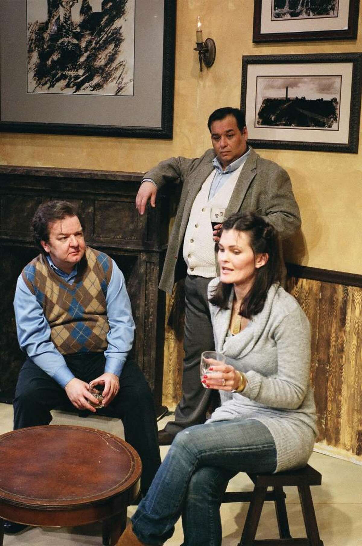 Jimmy (Tom Rushen) and Finbar (Stephen DiRocco) listen as Valerie (Linda Branch Moran) tells her story in the Town Players of New Canaan’s production of Conor McPherson’s award winning drama THE WEIR.