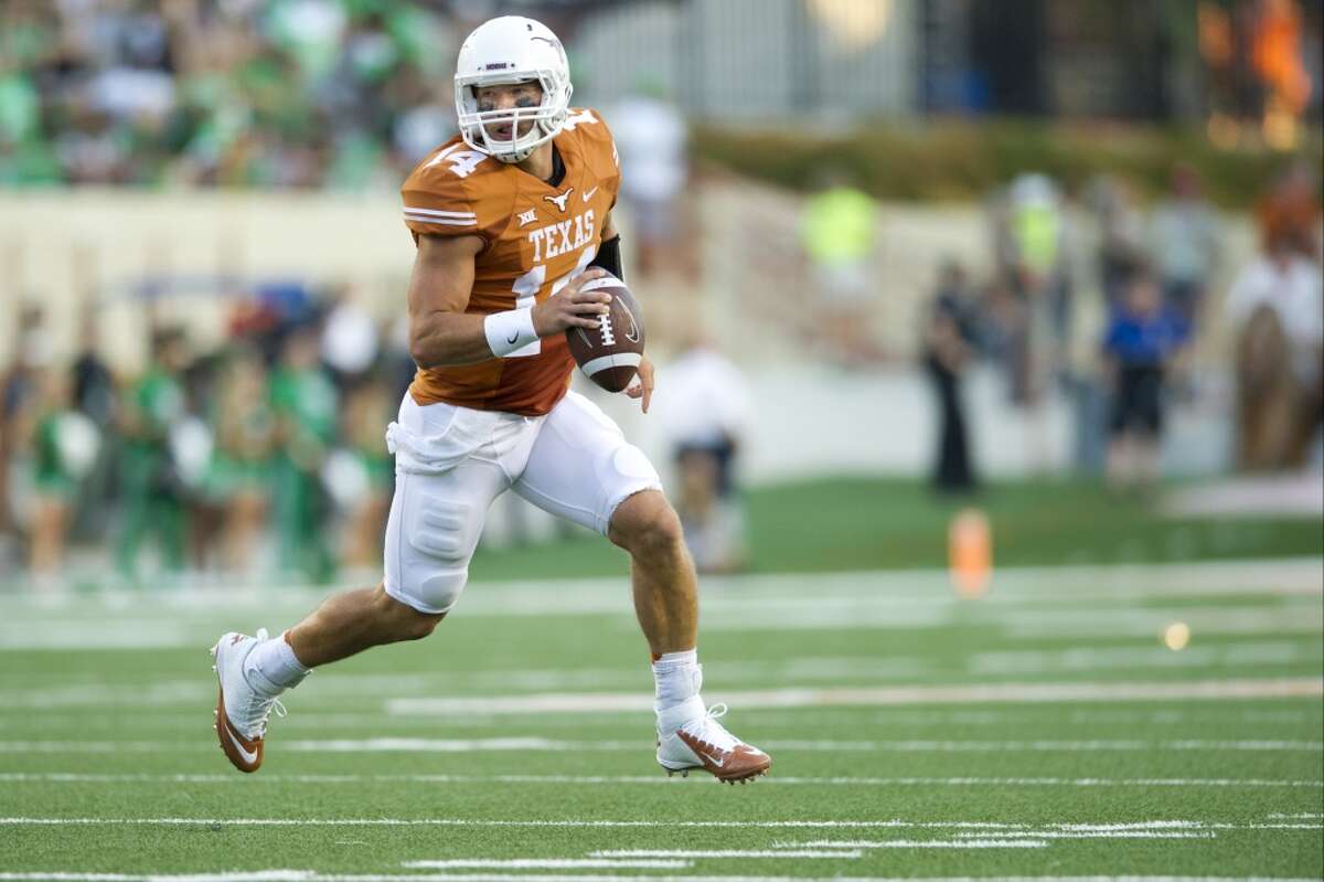 AUSTIN, TX - AUGUST 30: David Ash #14 of the Texas Longhorns scrambles against the North Texas Mean Green during the first quarter on August 30, 2014 at Darrell K Royal-Texas Memorial Stadium in Austin, Texas. (Photo by Cooper Neill/Getty Images)