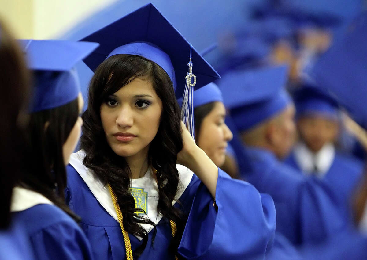 Don’t believe those who say Texas suffers low high school graduation rates. South San High School Valedictorian Lisa Maria Torres waits for the start of graduation ceremonies at Freeman Coliseum in 2010.