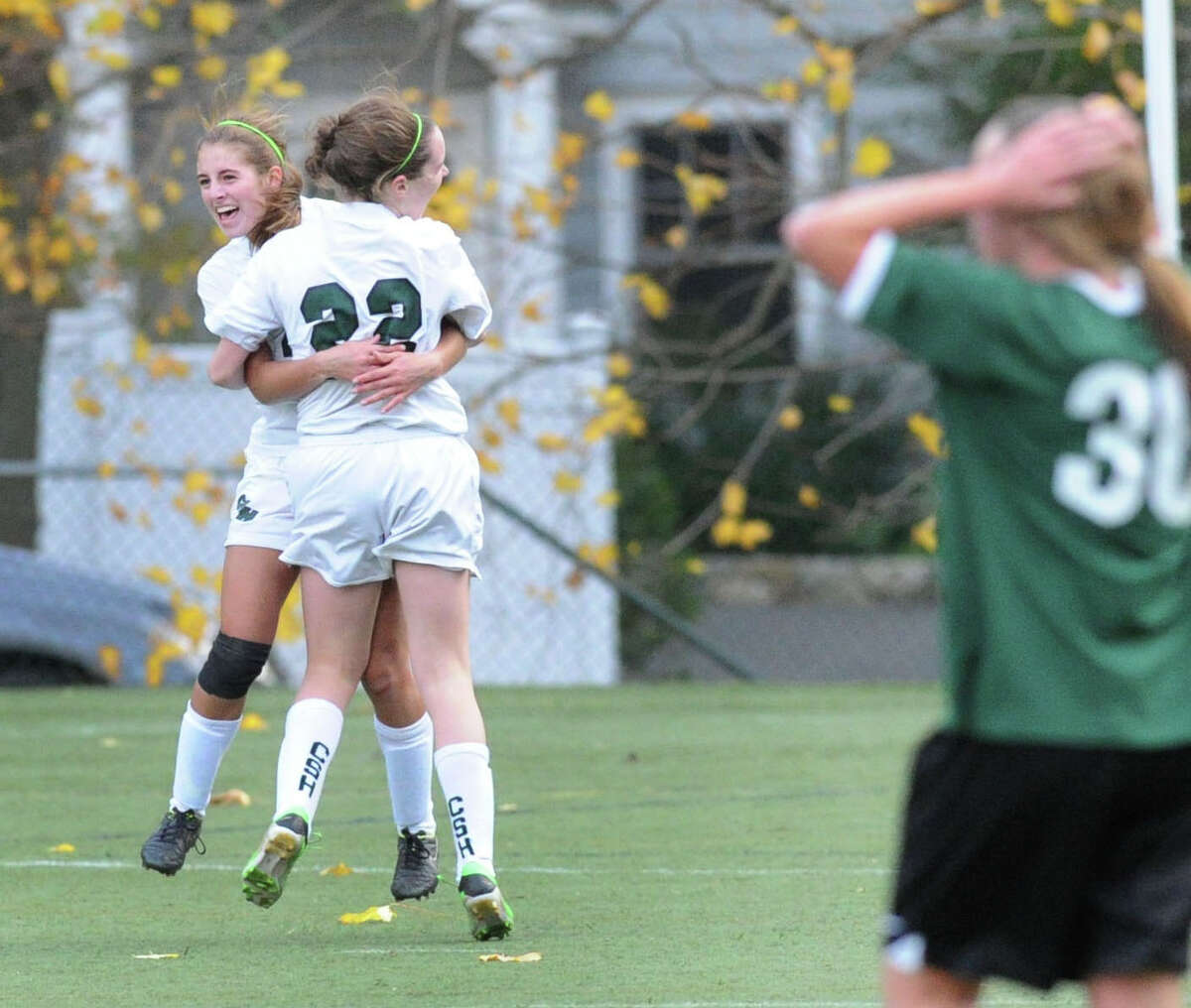Convent of the Sacred Heart's Tracey Hagan, left, is congratulated by teammate, Erin Cleary (#22), after Hagan got what turned out to be the winning goal during the FAA girls soccer championship match between Greenwich Academy and Convent of the Sacred Heart at Greenwich Academy, Conn., Friday, Nov. 7, 2014. Convent won the championship by a score of 3-2 with Hagan's deciding goal with 2:13 left in overtime.