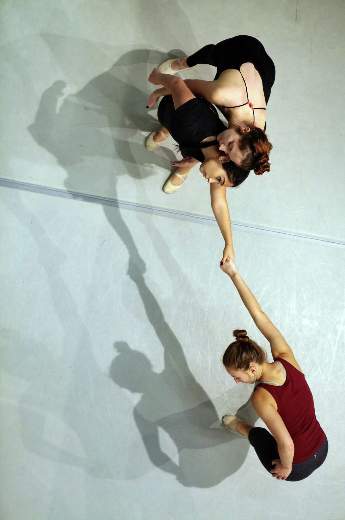 Kassidy Friend (top) with Sarah Escobedo and Madelin Braun (below) practice at the S.F. State dance studio.