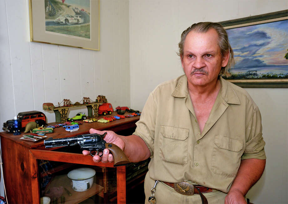 redditt holds out a collectors bb gun at his port neches hmee