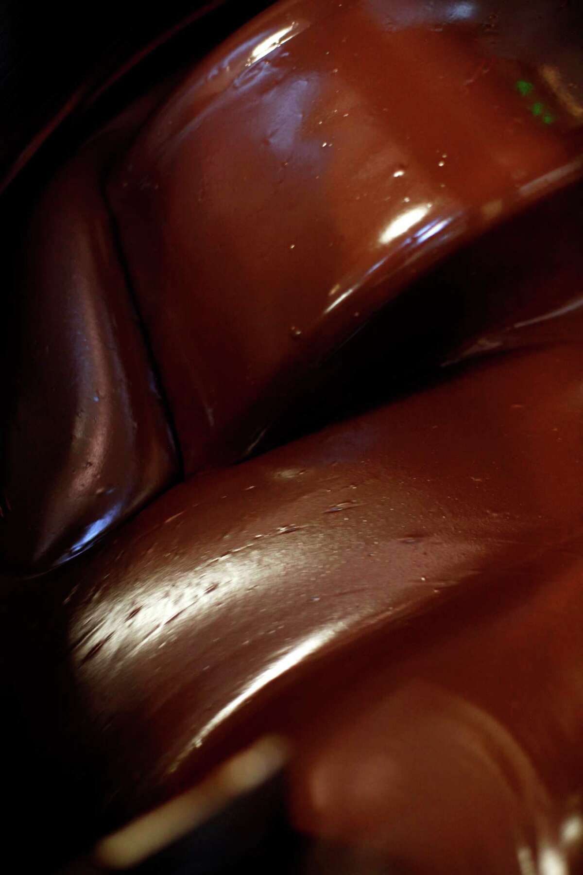 Chocolate is churned in the melanger, a process that takes two to four days, at Dandelion Chocolate in San Francisco.