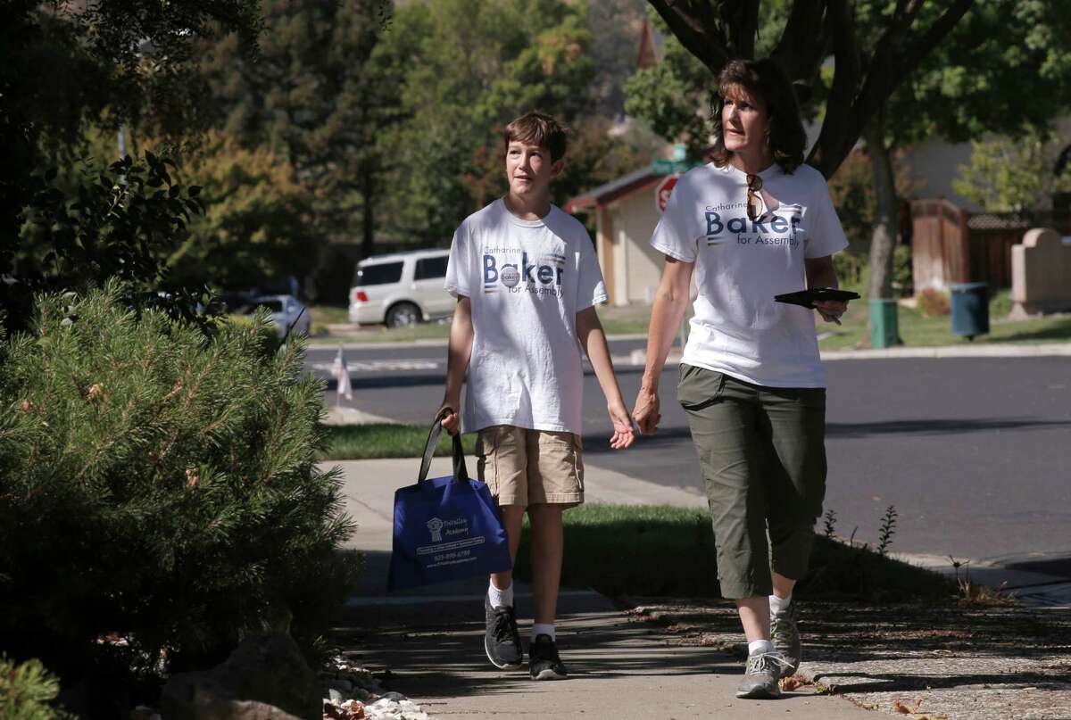 Assemblywoman-elect Catharine Baker campaigns in a Pleasanton neighborhood with her son Alex in September.