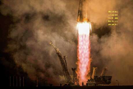 A Soyuz rocket launches the Expedition 41 crew of Alexander Samokutyaev, Elena Serova and Butch Wilmore on Sept. 26.
