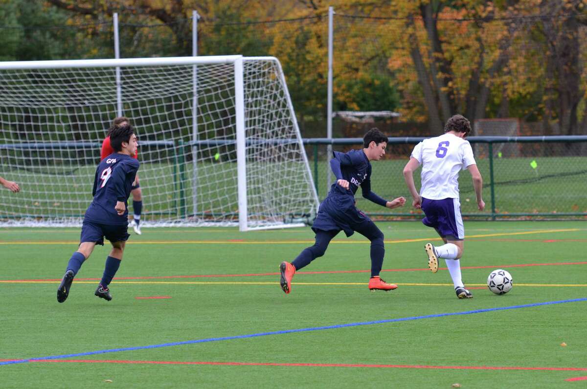 From left: GFA's Matt Allen and sophomore Hobi Lew track down a Masters forward during their FAA final game on Friday, Nov. 7. Masters scored in the final minutes of the game for the win