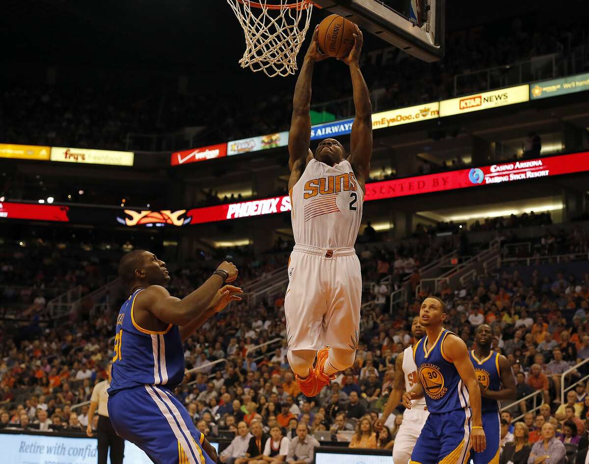 Phoenix Suns guard Eric Bledsoe (2) dunks against the Golden State Warriors in the second half during an NBA basketball game, Sunday, Nov. 9, 2014, in Phoenix. (AP Photo/Rick Scuteri)
