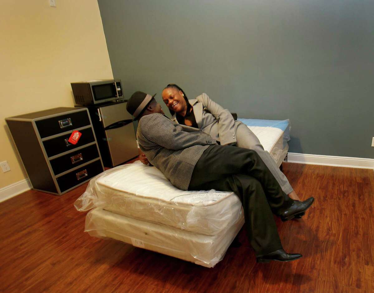 Clarence Cook and his fiancé Lynette Baldwin enjoyed a light moment as they relaxed in one of the rooms at 250 Kearny Street Monday November 10, 2014. Cook expects to move in soon. One hundred and thirty homeless veterans will get permanent supportive housing at 250 Kearny Street in San Francisco, Calif. to further the goal of ending chronic veteran's homelessness.