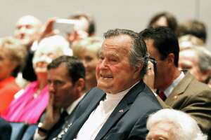 Bush's breathing improving, but he will remain in hospital