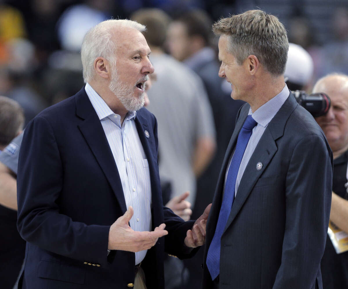 Steve Kerr (right) played for Gregg Popovich in San Antonio, but Kerr lost to him as a coach in Tuesday’s Warriors game.