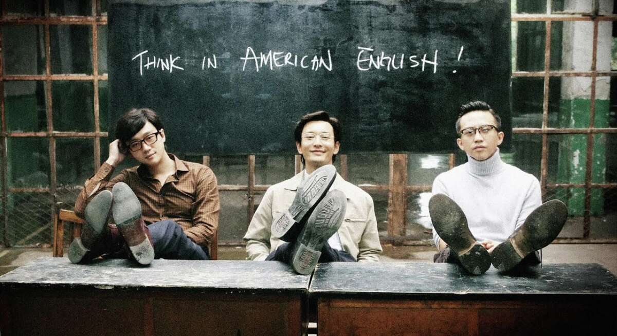 Wang (Tong Daiwei, left), and Cheng (Huang Xiaming) start a language school for potential emigres, while Meng (Deng Chao) heads for the USA himself in “American Dreams in China.”